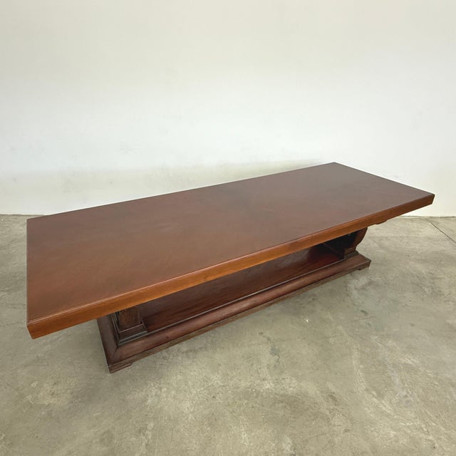 Dimensions: H 29.5” x W 110” x D 41.3” Monumental French Art Deco dining table. Carved walnut, renewed top. Seats up to...