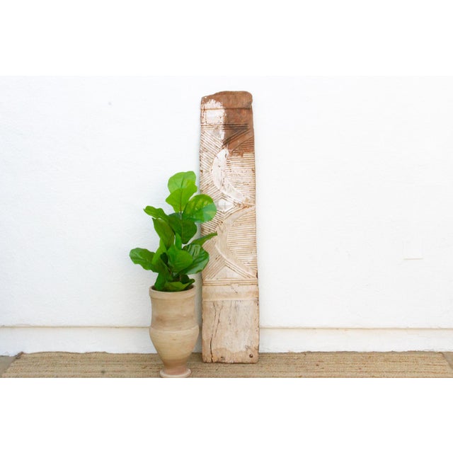 This 60-inch panel is a narrow Igbo wall element rather than a full door, hand-carved from a single slab just 13 inches...