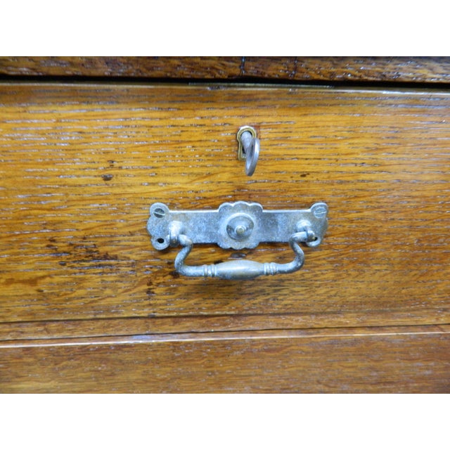 This Victorian Solid Oak Chest of Drawers is a stunning piece of antique furniture, handmade during the Victorian era...