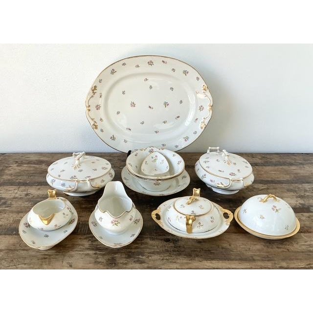 Evoke the timeless elegance of a French countryside estate with this exquisite 8-piece set of vintage Limoges porcelain...