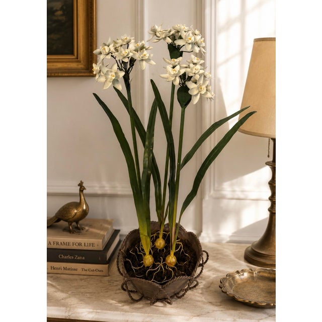An exceptional vintage metal tole floral arrangement featuring elegant white narcissus blooms rising from realistic...