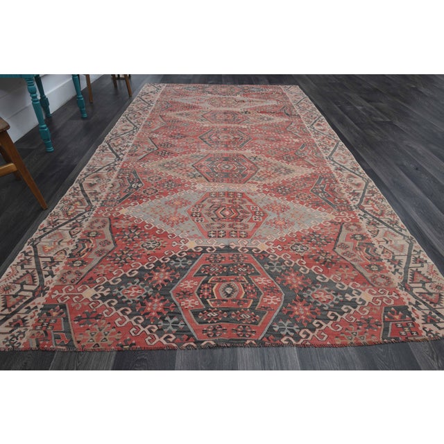 Vintage Hand-Knotted area rug is a semi-antique vintage area rug. The '70s Eastern region of Anatolia's unique rug is...