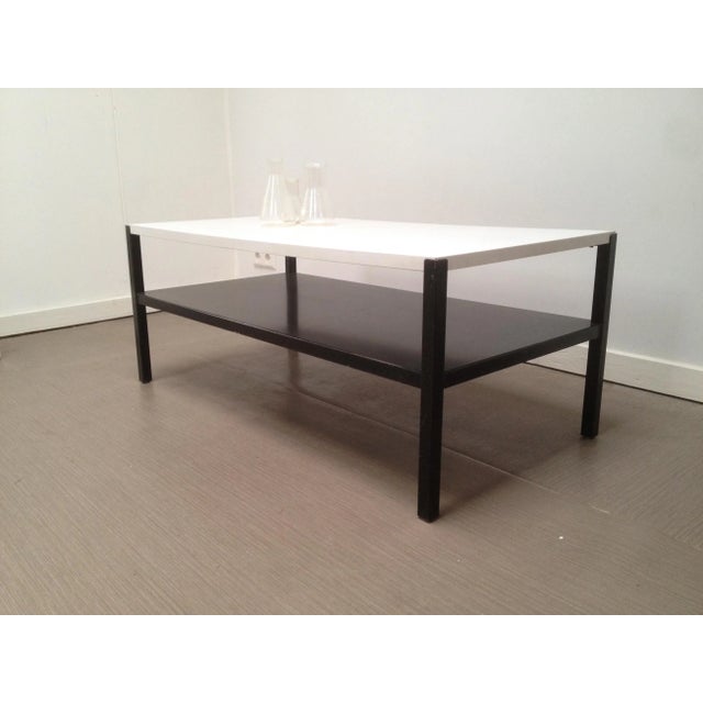 This Regal coffee table was designed by Wim Rietveld in 1960 and produced by Ahrend de Cirkel. The frame is made of a...