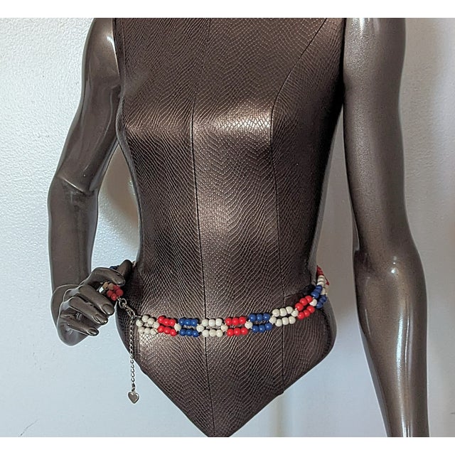 Rare early 1970's belt. The beaded part of the belt is 28" in length. Flexibility in where it hangs on the hips for...