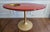 A one-of-a-kind handcrafted red and gold epoxy resin clock table designed as both functional furniture and statement art....