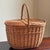 Offering a gorgeous rustice European-style wicker picnic / market basket. It features an unusual oval shape, pretty French...
