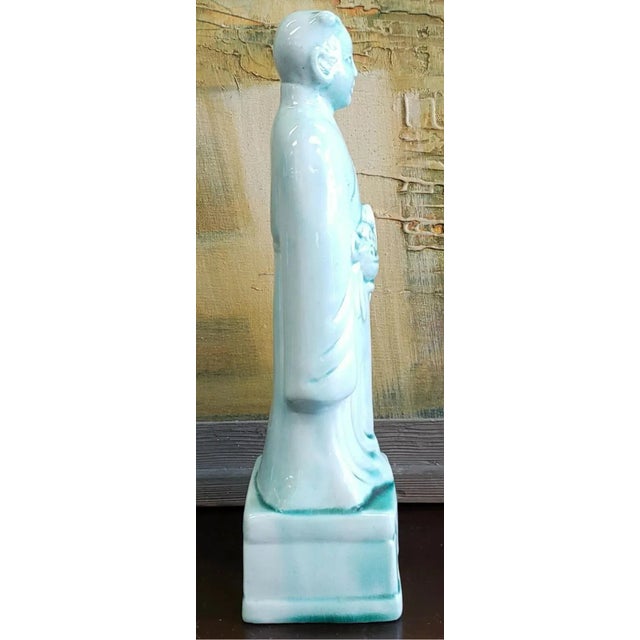 Up for sale is a Mid 20th Century Chinese Celadon-Glazed Porcelain Court Attendant Figurine! It measures 10 7/16" tall....