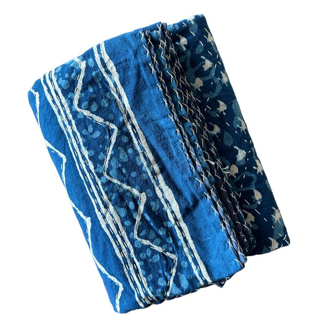 The deep, rich indigo hues evoke a sense of nostalgia, while the quilted pattern adds both texture and warmth. Whether...