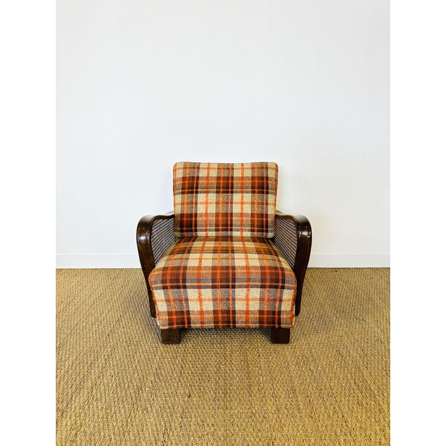 Elegant vintage armchair with timeless charm, combining the warmth of bentwood with the lightness of natural caning. this...