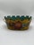 A delightful antique tole planter featuring a warm ochre-yellow ground adorned with hand-painted floral garlands in rich...