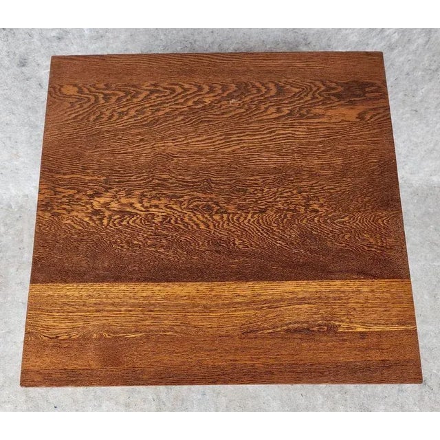 Vintage square quarter-sawn oak two tier side table. The table has cabriole style legs with a bottom shelf. The table is...