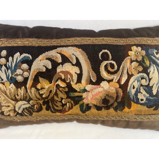A beautiful pillow upholstered in 18th-century tapestry, featuring flowers and arabesque's. Rich in antique character and...