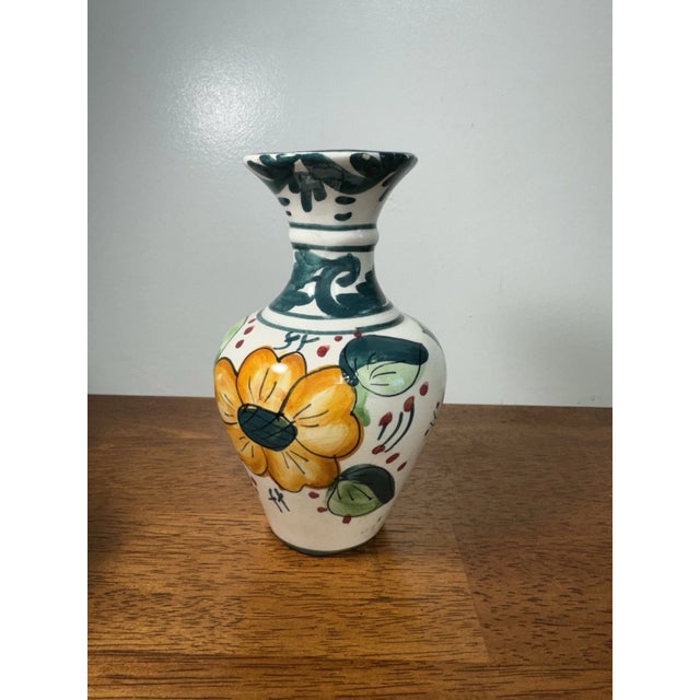 Small hand-painted ceramic vase featuring a colorful floral design. Marked “Tenerife”, origin from the Canary Islands....