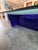 Large sculptural postmodern coffee table featuring a thick tempered glass top with an asymmetrical geometric form and bold...