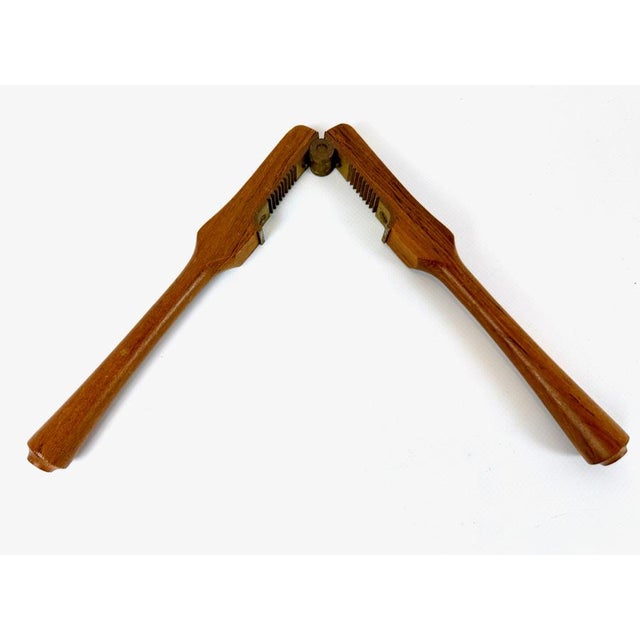 Mid-Century Modern Teak and Brass Nutcracker by Poul Knudsen, 1950s, in Very Good conditions. Designed 1950 to 1959 This...