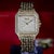 This Cartier Panthere reference 8839 Jumbo features a full pave diamond-set dial, bezel, and case in 18K yellow gold, with...