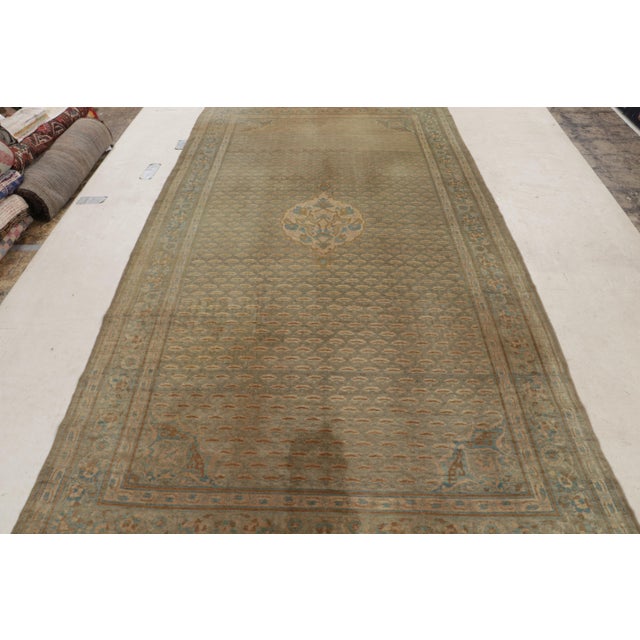 This hand knotted antique Sivas wool rug originates from Turkey between 1880-1890, enjoying an intriguing layering of...
