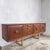 An exceptional mid century teak long sideboard by Stonehill Furniture , combining bold British design with superb...