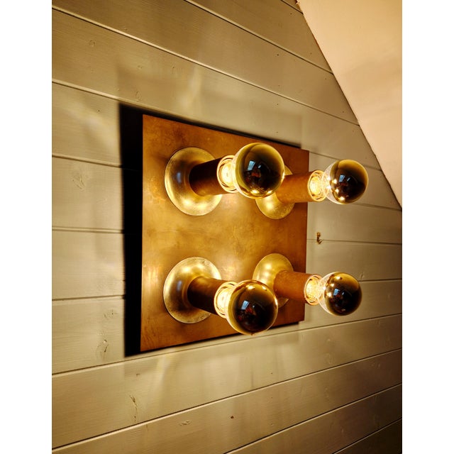Square brass space age ceiling/wall light with four tubular lights, produced by the german manufacturer cosack leuchten in...