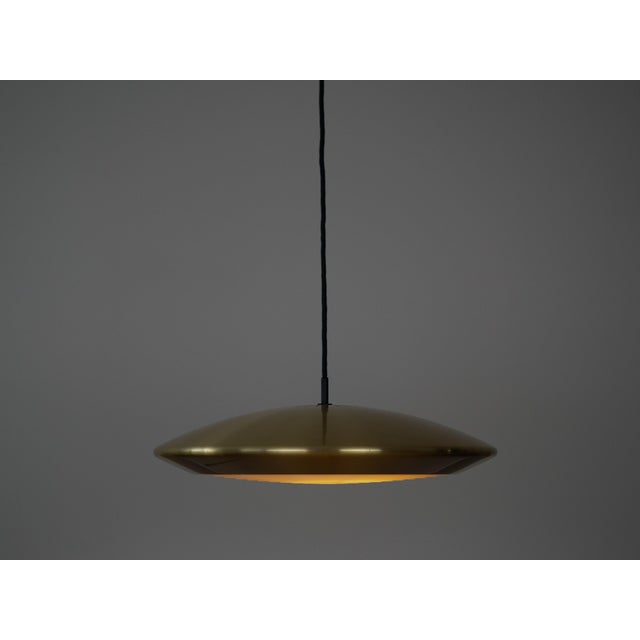 The Diskos lamp, designed by Jo Hammerborg, is a classic example of Danish modernist design, distinguished by its elegant...