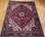 "This vintage Persian Heriz rug from the second quarter of the 20th century features a rich red field as the vibrant...