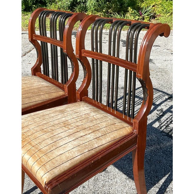 Enhance your living space with this exquisite pair of vintage Regency scroll back chairs. Featuring a timeless Regency...