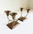 A pair of 1950's mixed metal brass and copper candlesticks in the style of Mexican maker Los Castillo. Features a copper...
