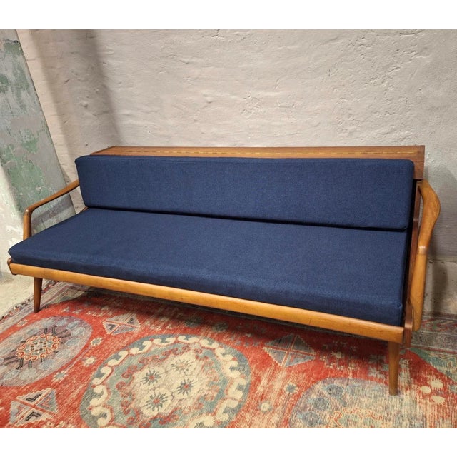 Danish teak daybed / sofa with new fabric. The back can be raised to reveal a compartment for bedding etc and to use the...