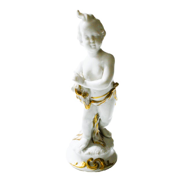 Vintage Putti/Cherub figurine with gold-gilding details. Stylized after the historic European Capodimonte design....