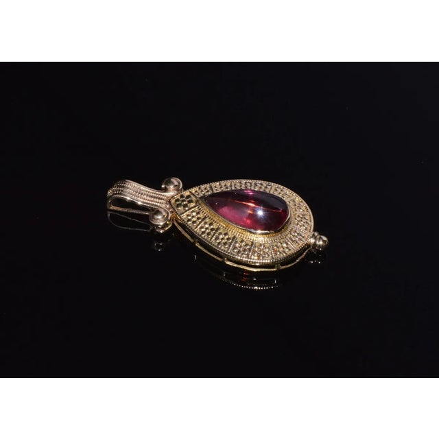 This is a gorgeous natural pink tourmaline pendant. This finely crafted 18K solid gold pendant features a 100% natural...