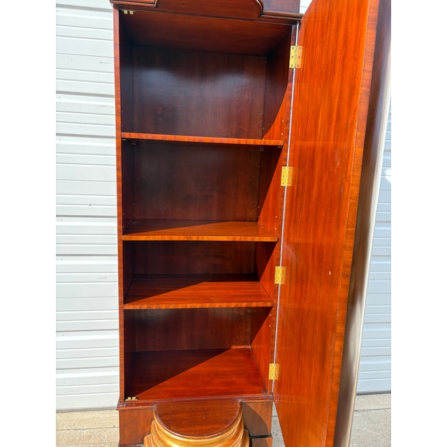 This is a vintage handmade cabinet by Maitland Smith in the form of a classical column. This large classical column is in...