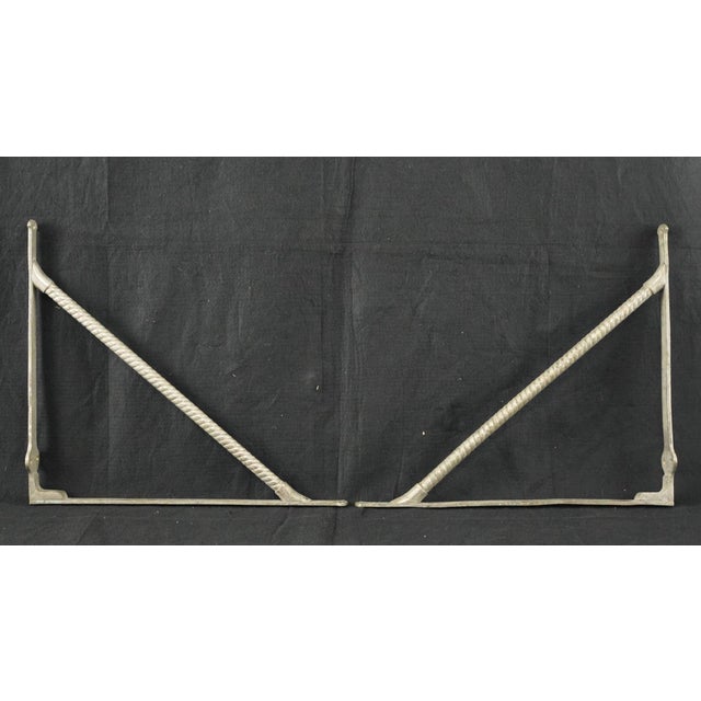 Reclaimed nickel plated brass shelf brackets featuring a twisted rope design on the support bar. The original mounting...