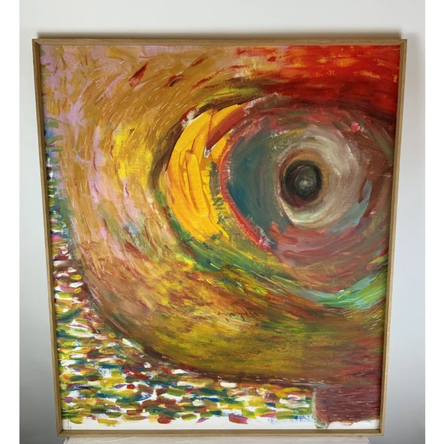 This colorful eye painting makes quite an impact! It has clean lines with a beautiful frame that matches the modern style....