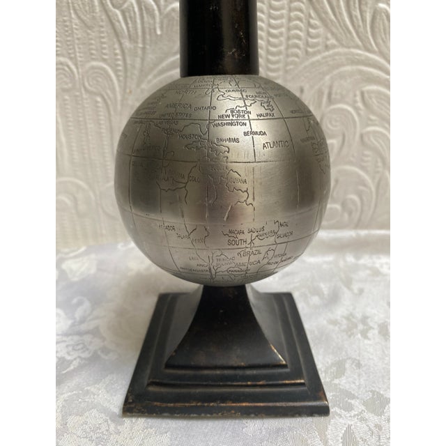 Rare find, this mid Century globe paperweight is truly one of a kind. The base is iron, so has some weight to it.