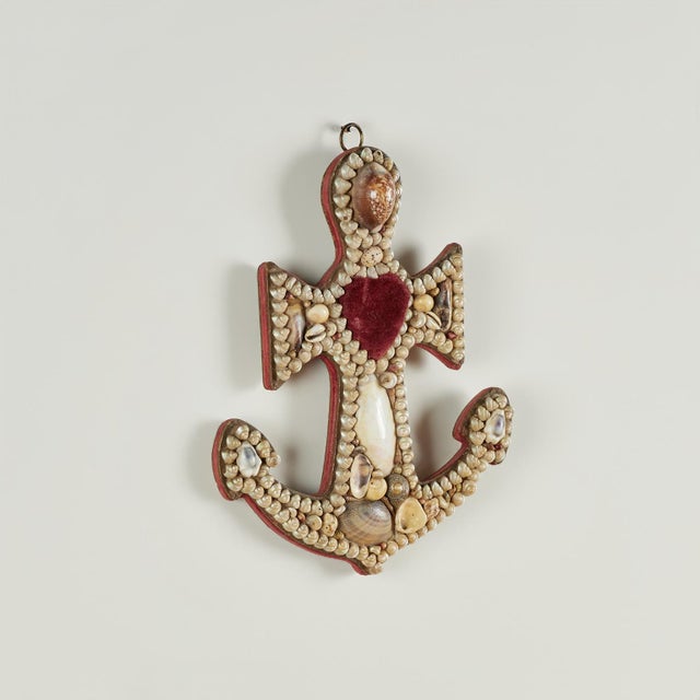 Rare and unusual antique sailor valentine handcrafted in exotic seashells in anchor form with a heart shaped pin cushion.