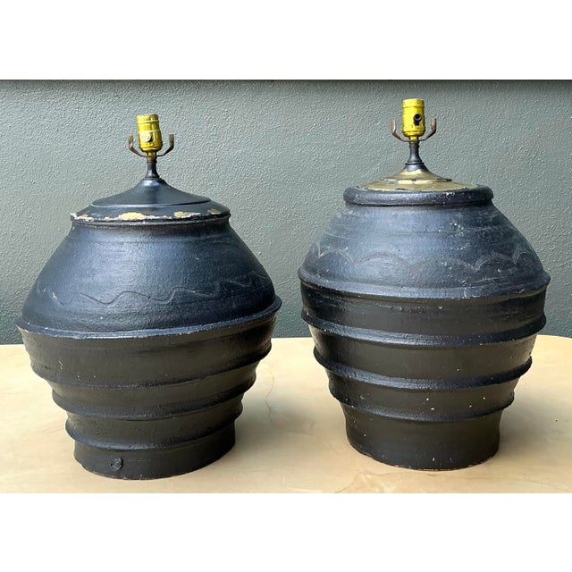 Elevate your space with this commanding pair of vintage Greek terracotta lamps. Expertly hand-thrown, these large-scale...