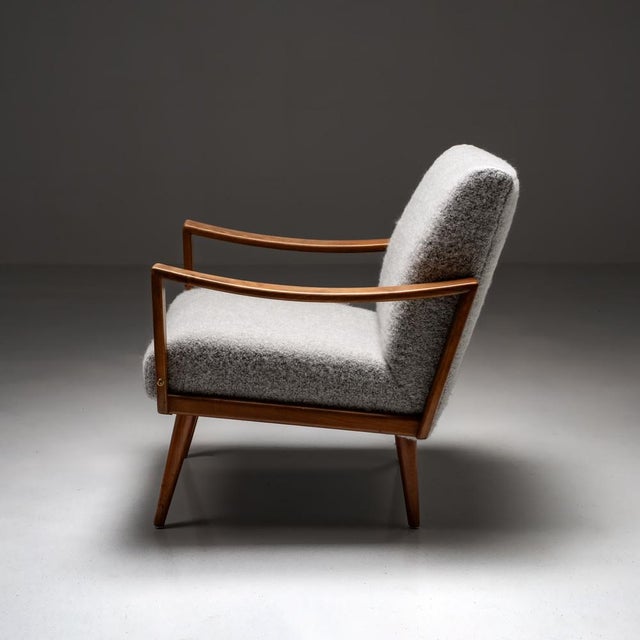 This beautiful wooden armchair from the 1960s has a simple yet elegant design that adds a touch of vintage charm to any...