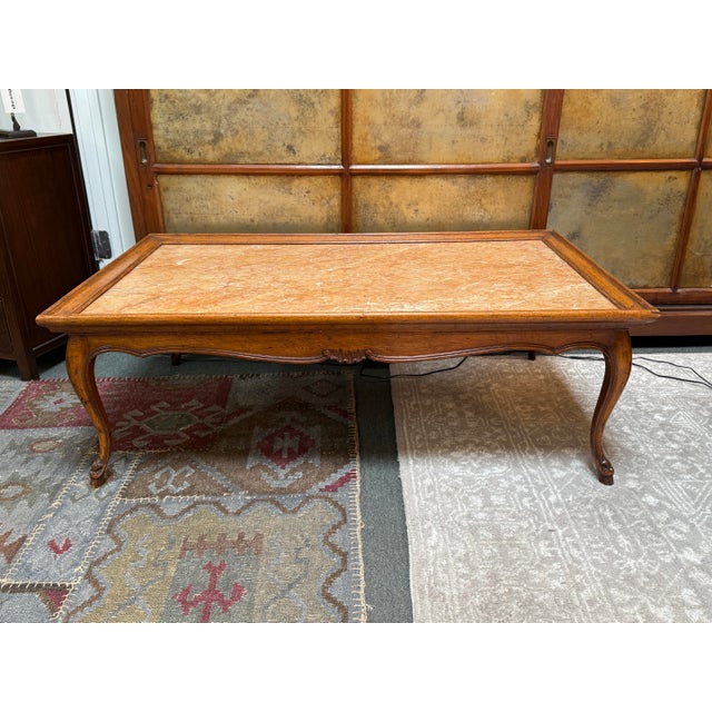 Design Plus Gallery presents a French Louis XV Reproduction Coffee Table from the Late 20th Century. The table has a nice...