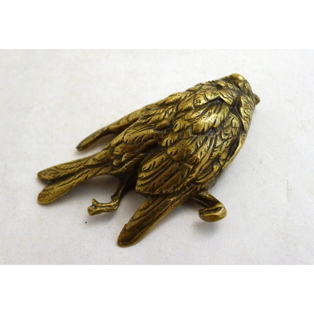 Dead Bird Paperweight: small hollow gilt bronze sculpture of a small dead or injured bird, naturalistic representation,...