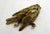 Dead Bird Paperweight: small hollow gilt bronze sculpture of a small dead or injured bird, naturalistic representation,...