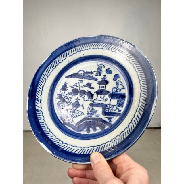 Antique blue and white Chinese porcelain dish. Primitive Canton Blue Willow scene, featuring houses, a pagoda, willow...