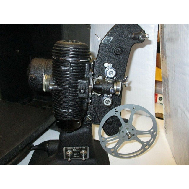 Comes in original factory black case with instructions.The Vintage 1930's Bell and Howell 8MM Filmo Master 400 Design 122...