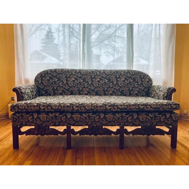 19th century Chippendale sofa with matching armchair. Detailed carved walnut wood. Newly upholstered with damask cut...