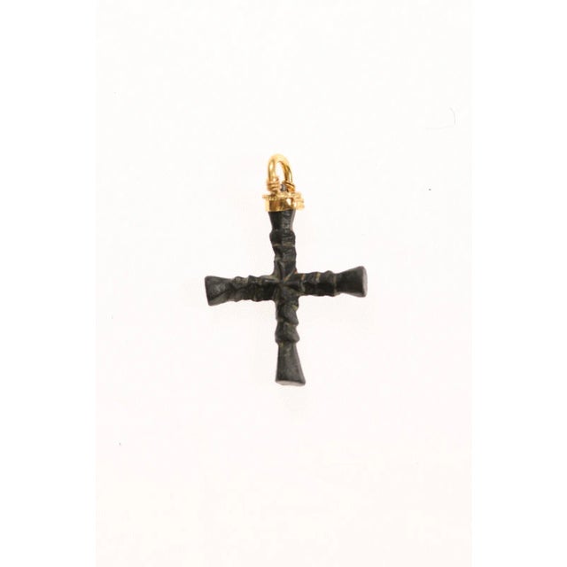 A small bronze cross fashioned into a pendant and accented with 21K gold. This from the 1st to 3rd Century AD and was...