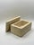 A beautifully crafted solid travertine decorative box featuring clean architectural lines and warm natural stone veining....