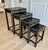 An elegant and increasingly rare graduated set of four vintage Asian export nesting tables, handcrafted from solid...