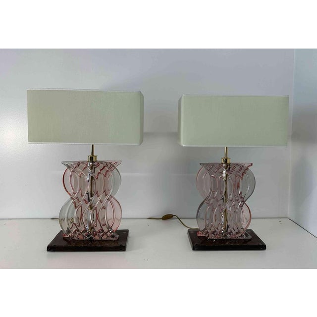 This pair of Art Deco Style lamps was produced in Italy in the 2000s. The central part of the structure is in gold...