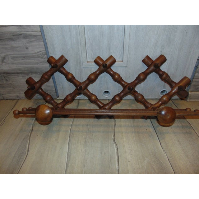 Vintage wooden hanger from the 1970s. Dimensions - height: 32 cm, depth: 22 cm, width: 83.5 cm.