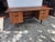 A nice walnut 1960s Mid Century Desk. Three smaller drawers on right side the left has one drawer and a file drawer....