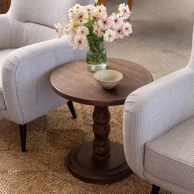 Lovely carved wood table from France, 1940s. Thick carved wood stem with circular top and base. Base has carved ring...